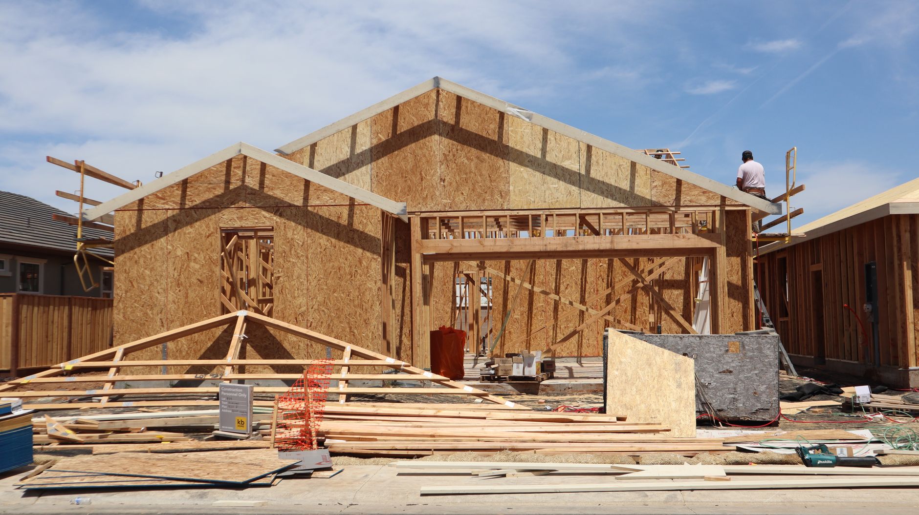 Carpenters framing the upper floor of a new house