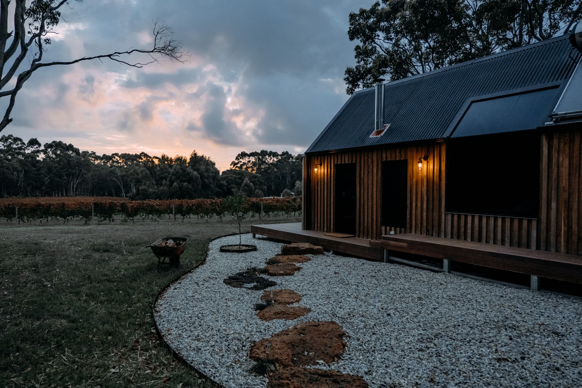 A newly built two-storey house with dark cladding