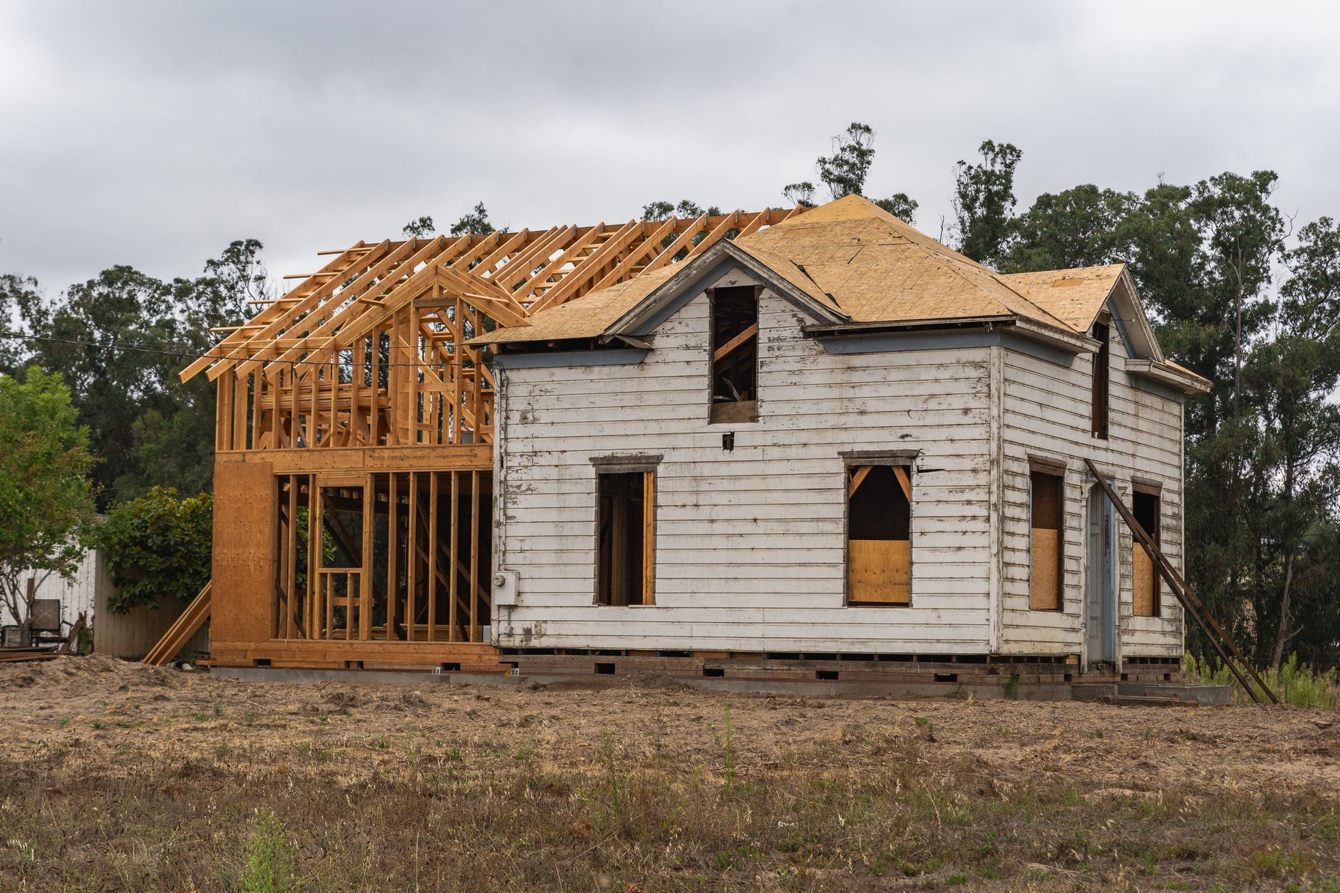 New framing built against the back of an older house
